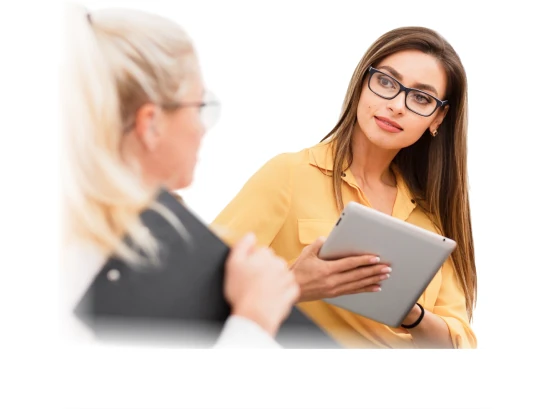 A therapist and client reviewing progress on a tablet together